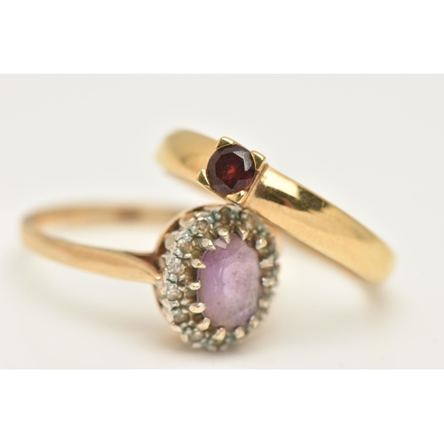 425 - A 9CT GOLD AMETHYST AND DIAMOND CLUSTER RING AND A GARNET RING, of an oval form, centring on an oval... 