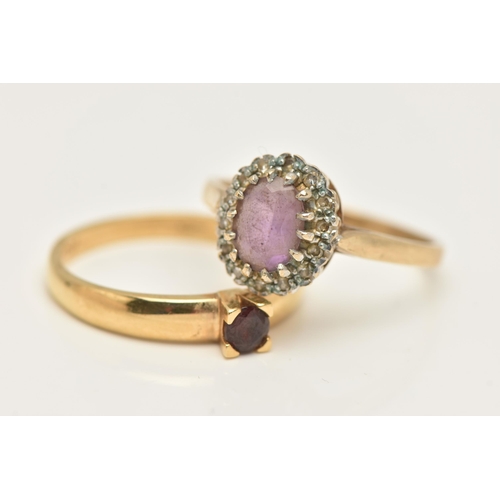 425 - A 9CT GOLD AMETHYST AND DIAMOND CLUSTER RING AND A GARNET RING, of an oval form, centring on an oval... 