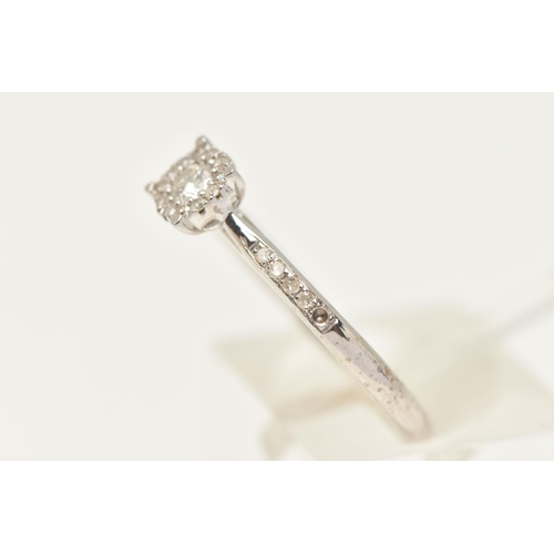 430 - A 9CT WHITE GOLD DIAMOND CLUSTER RING, set with a central round brilliant cut diamond, claw set with... 