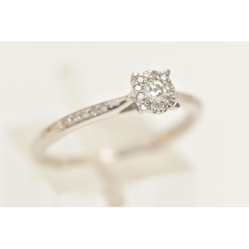 430 - A 9CT WHITE GOLD DIAMOND CLUSTER RING, set with a central round brilliant cut diamond, claw set with... 