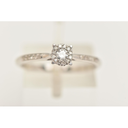 430 - A 9CT WHITE GOLD DIAMOND CLUSTER RING, set with a central round brilliant cut diamond, claw set with... 