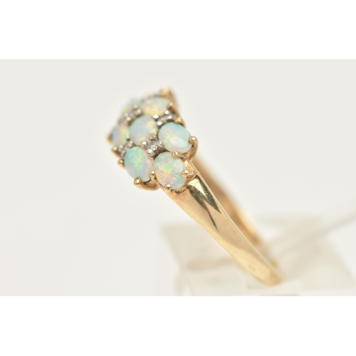 436 - A 9CT GOLD OPAL CLUSTER RING, ten oval cabochon opals prong set in yellow gold, with seven single cu... 