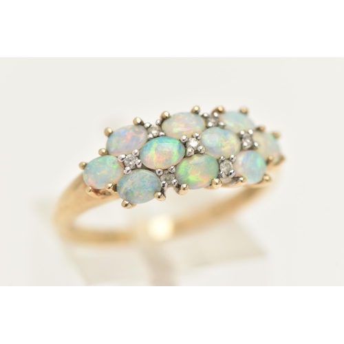 436 - A 9CT GOLD OPAL CLUSTER RING, ten oval cabochon opals prong set in yellow gold, with seven single cu... 