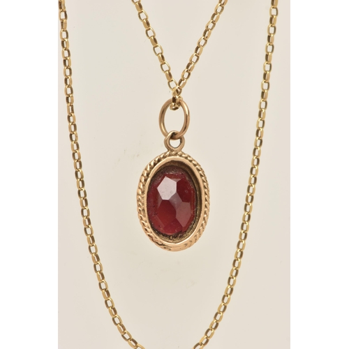 446 - A 9CT GOLD GARNET PENDANT WITH CHAIN, the pendant of an oval form, in a milgrain collet set with a f... 