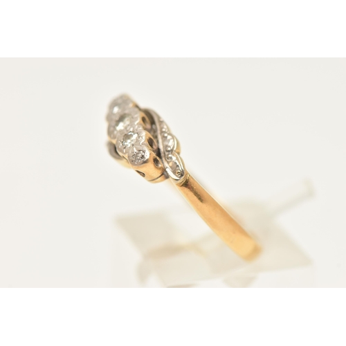 449 - A YELLOW METAL FIVE STONE DIAMOND RING, set with a central round brilliant cut and four single cut d... 