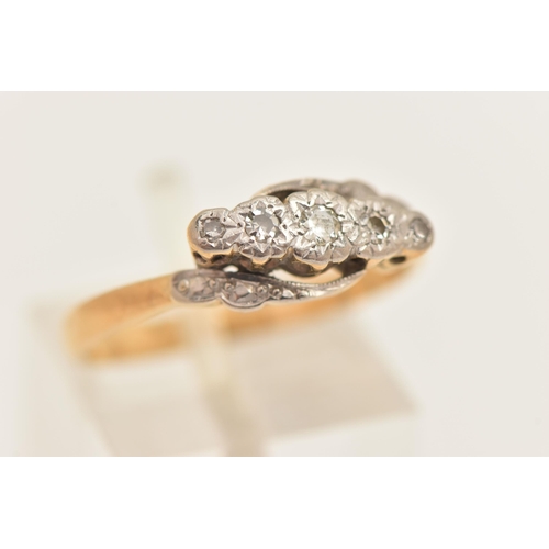 449 - A YELLOW METAL FIVE STONE DIAMOND RING, set with a central round brilliant cut and four single cut d... 