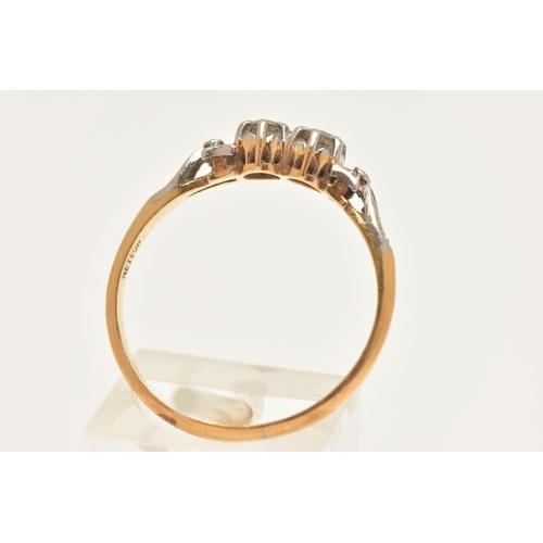 450 - A YELLOW AND WHITE METAL DIAMOND RING, two claw set round brilliant cut diamonds, in a white metal m... 