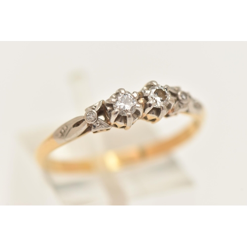 450 - A YELLOW AND WHITE METAL DIAMOND RING, two claw set round brilliant cut diamonds, in a white metal m... 