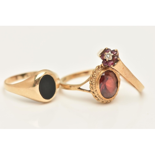 451 - THREE 9CT GOLD GEM SET RINGS, to include a garnet and diamond cluster ring, ring size R 1/2, a garne... 