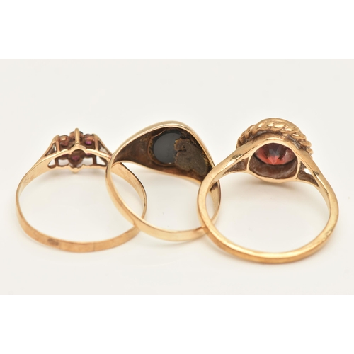 451 - THREE 9CT GOLD GEM SET RINGS, to include a garnet and diamond cluster ring, ring size R 1/2, a garne... 