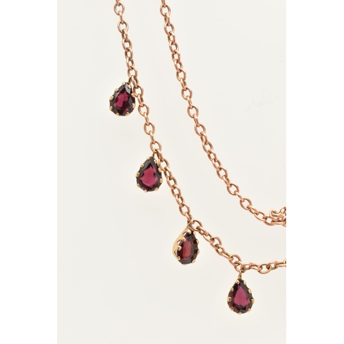 452 - A ROSE METAL GARNET NECKLACE, cable chain fitted with eight pear cut garnet droppers, each in a claw... 