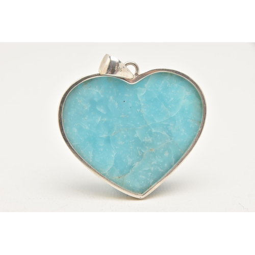 462 - A WHITE METAL HARDSTONE PENDANT, a bright blue hard stone in the form of a heart, collet set in whit... 