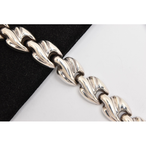 465 - A WHITE METAL BRACELET, a chunky fancy link bracelet, fitted with an integrated push pin clasp, appr... 