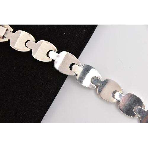 465 - A WHITE METAL BRACELET, a chunky fancy link bracelet, fitted with an integrated push pin clasp, appr... 