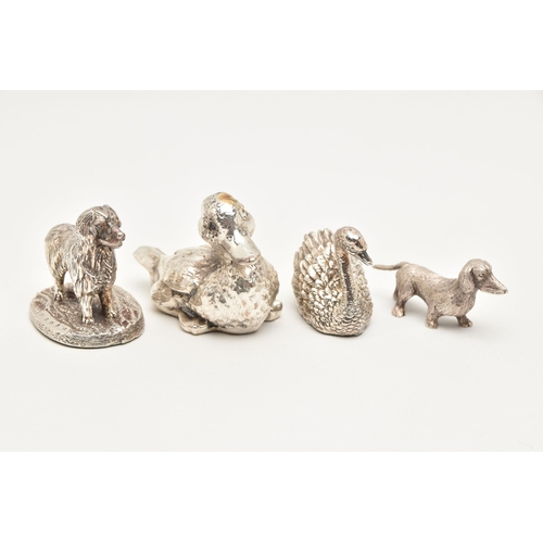 471 - FOUR SILVER AND WHITE METAL ANIMAL FIGURINES, the first a small dachshund, approximate length 58mm, ... 