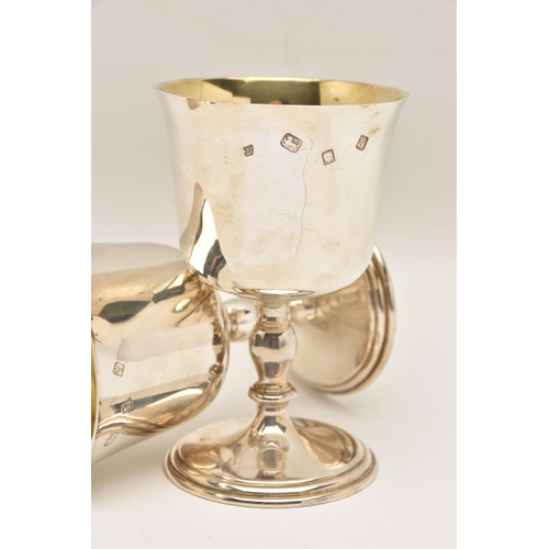 481 - A PAIR OF ELIZABETH II SILVER GOBLETS, polished cups with knopped stems on round bases, gilt interio... 