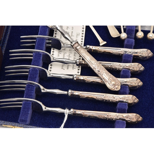 500 - AN ASSORTMENT OF SILVER CUTLERY, to include a cased set of six silver handled tea forks and a matchi... 