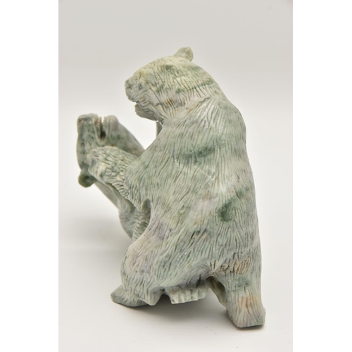 509 - A CARVED JADIETE ORNAMENT, two fighting bears, approximate width 175mm x height 145mm, (condition re... 