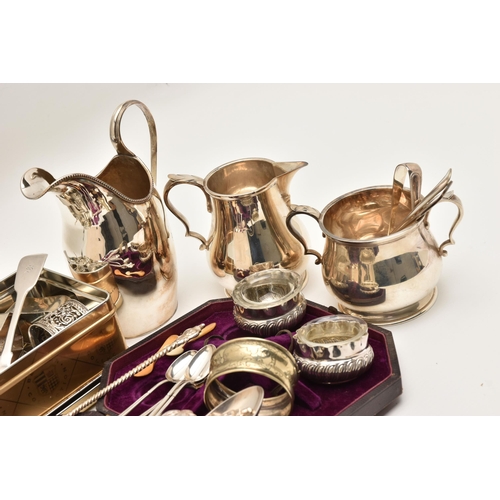 511 - A BOX OF SILVER AND WHITE METAL WARE, to include five silver napkin rings of various designs, each w... 