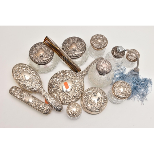 512 - A BOX OF ASSORTED SILVER VANITY ITEMS, to include six glass jars with silver lids, a glass bottle wi... 