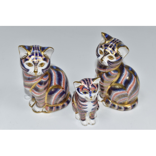 758 - A GROUP OF THREE ROYAL CROWN DERBY PAPERWEIGHTS comprising two 'Cats,' one with a fixed ceramic back... 