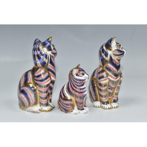 758 - A GROUP OF THREE ROYAL CROWN DERBY PAPERWEIGHTS comprising two 'Cats,' one with a fixed ceramic back... 