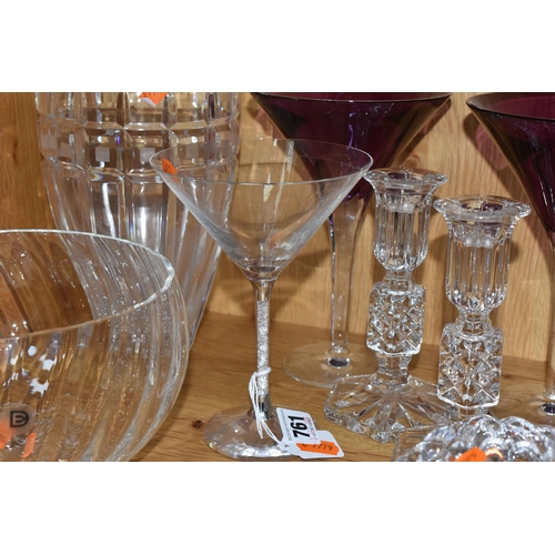 761 - A GROUP OF NINE CRYSTAL GLASS DECORATIVE ITEMS to include a pair of Waterford purple martini glasses... 