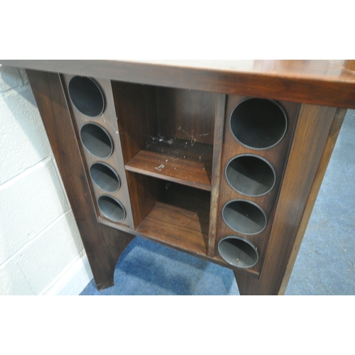 295 - A MID CENTURY ROSEWOOD BAR, the square tile top surrounding a central ice bucket, two sides are plan... 