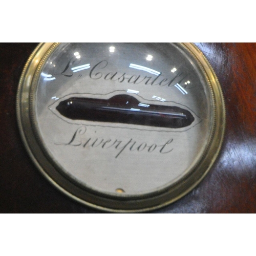 151 - L CASARTELLI OF LONDON, A MAHOGANY BANJO BAROMETER, with twin swan neck pediment, a dry/damp dial, a... 