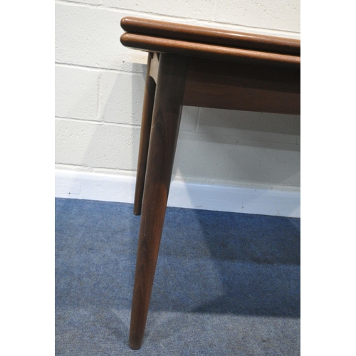 153 - A MID CENTURY TEAK DRAW LEAF DINING TABLE, raised on cylindrical tapered legs, extended length 250cm... 