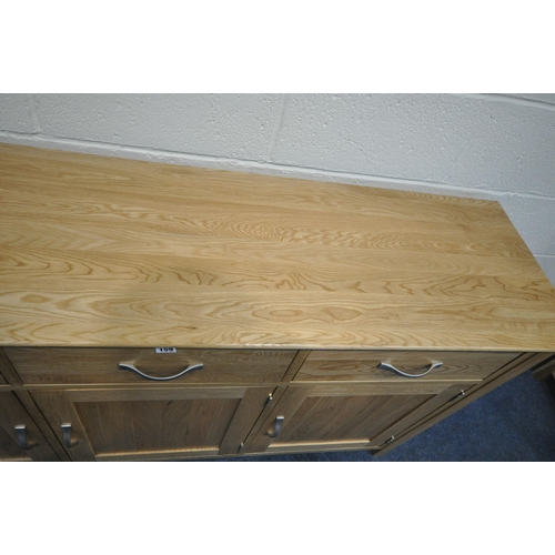 159 - A MODERN LIGHT ASH SIDEBOARD, fitted with three drawers, over three cupboard doors, length 158cm x d... 