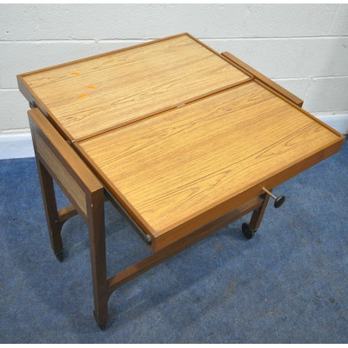 164 - A MID CENTURY TEAK TWO TIER METAMORPHIC TROLLEY, with Flexello castors, width 78cm x depth 38cm x he... 