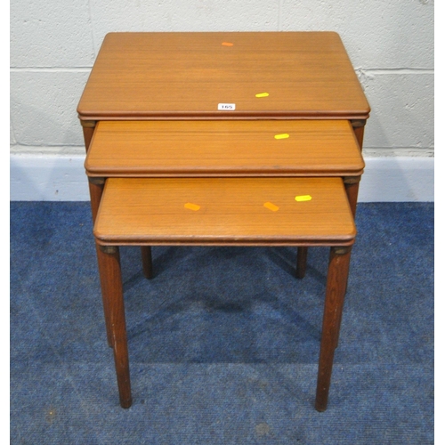 165 - A MID CENTURY TEAK NEST OF THREE TABLES, raised on cylindrical tapered legs, largest table width 56c... 