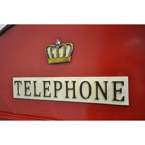 170 - A SCRATCH BUILT RED PAINTED METAL TELEPHONE BOX, the domed top with a clock to the front, the single... 