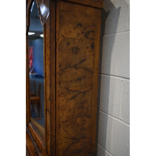 184 - A QUEEN ANNE (CIRCA 1710) FIGURED WALNUT DOUBLE DOME TOP BUREAU BOOKCASE, the double bevelled edge m... 