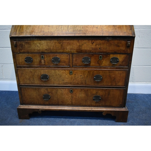 184 - A QUEEN ANNE (CIRCA 1710) FIGURED WALNUT DOUBLE DOME TOP BUREAU BOOKCASE, the double bevelled edge m... 