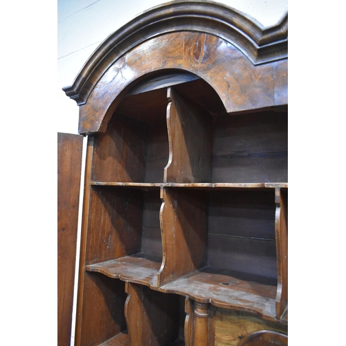 184 - A QUEEN ANNE (CIRCA 1710) FIGURED WALNUT DOUBLE DOME TOP BUREAU BOOKCASE, the double bevelled edge m... 