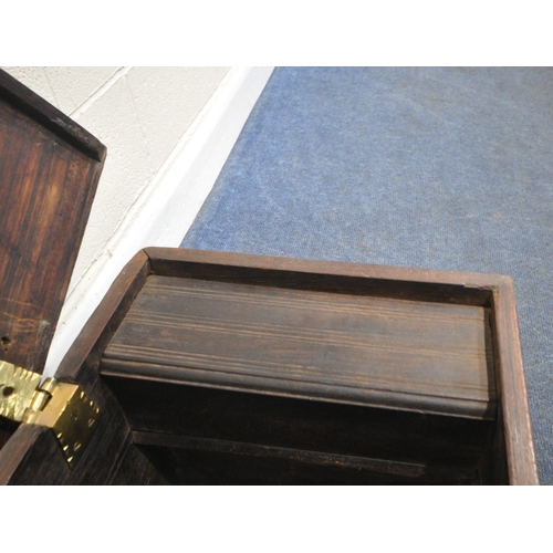 188 - A BRASS-STUDDED HARDWOOD ZANZIBAR CHEST, with twin brass handles, the hinged lid enclosing a candle ... 