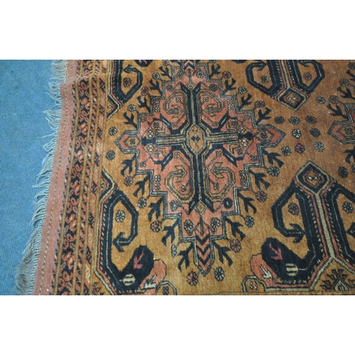 191 - AN AFGHAN GOLD GROUND RUG, with two central medallions, surrounded by a multi-strap border, 121cm x ... 