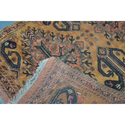 191 - AN AFGHAN GOLD GROUND RUG, with two central medallions, surrounded by a multi-strap border, 121cm x ... 