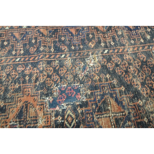 192 - A RED AND BLUE GROUND CARPET RUNNER, with repeating geometric patterns, surrounded by a multi-strap ... 