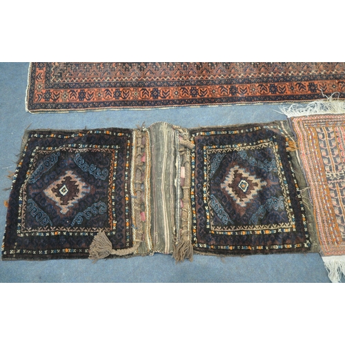 192 - A RED AND BLUE GROUND CARPET RUNNER, with repeating geometric patterns, surrounded by a multi-strap ... 