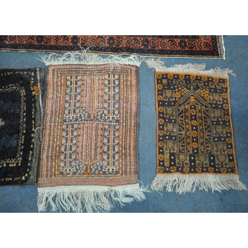 192 - A RED AND BLUE GROUND CARPET RUNNER, with repeating geometric patterns, surrounded by a multi-strap ... 