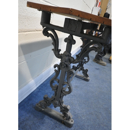 193 - A GREY PAINTED CAST IRON TABLE, with scrolled and mask details, and a later top surface, width 107cm... 