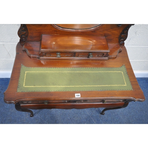 194 - A 20TH CENTURY HARDWOOD LADIES WRITING DESK , the raised back with a kidney shaped bevelled edge wal... 