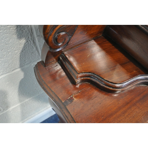 194 - A 20TH CENTURY HARDWOOD LADIES WRITING DESK , the raised back with a kidney shaped bevelled edge wal... 