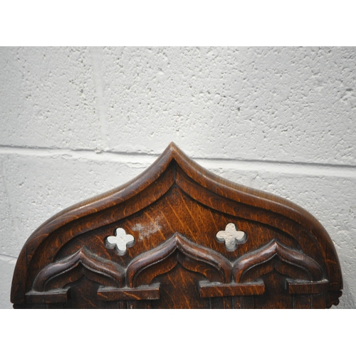 197 - A PAIR OF 20TH CENTURY OAK GOTHIC STYLE HALL CHAIRS, the shaped backrest with quatrefoil details, ra... 