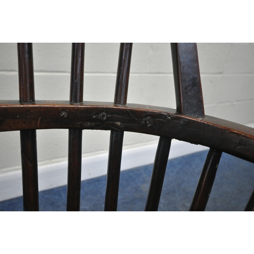 204 - A YEW WOOD WINDSOR HOOP BACK CHAIR, the spindles terminate to shaped armrests, an elm dished seat, r... 