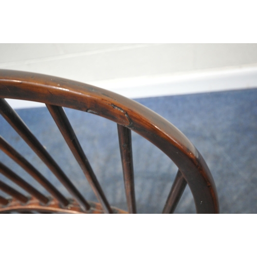 204 - A YEW WOOD WINDSOR HOOP BACK CHAIR, the spindles terminate to shaped armrests, an elm dished seat, r... 