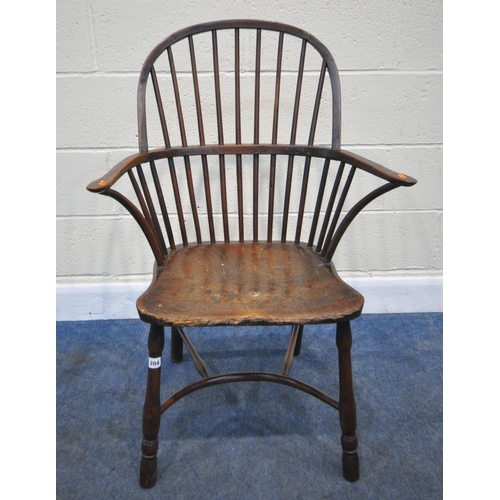 204 - A YEW WOOD WINDSOR HOOP BACK CHAIR, the spindles terminate to shaped armrests, an elm dished seat, r... 